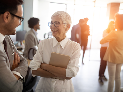 Colleagues at a networking event in an office