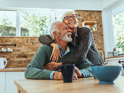 Shot of a mature woman hugging her husband