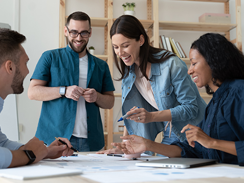 Overjoyed diverse businesspeople have fun engaged in creative thinking at team briefing in office, smiling multiracial colleagues laugh brainstorm discussing ideas at meeting, teamwork concept