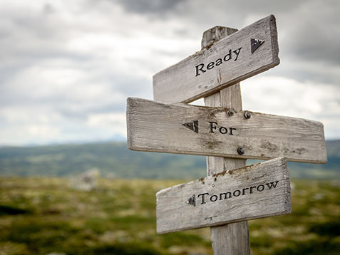 ready for tomorrow text on wooden signpost outdoors in nature
