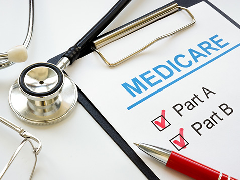 Medicare application form with marked plan A and B.