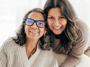 two related females smiling for a photo