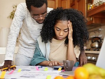 Woman and man reviewing paperwork together