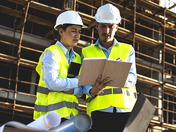 Construction workers having work meeting