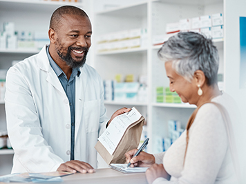medicine or prescription drugs sales at drug store. Health, wellness and medical insurance, black man and customer at pharmacy for advice and pills.