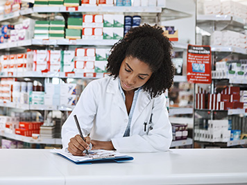 Cropped shot of a young female pharmacist working in a pharmacy.