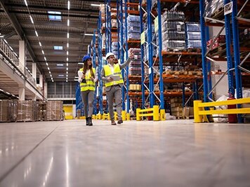 two workers on whole sale distribution floor