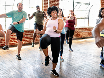 Diverse people in an active dance class