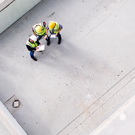 Overhead view of construction workers engineers at construction site